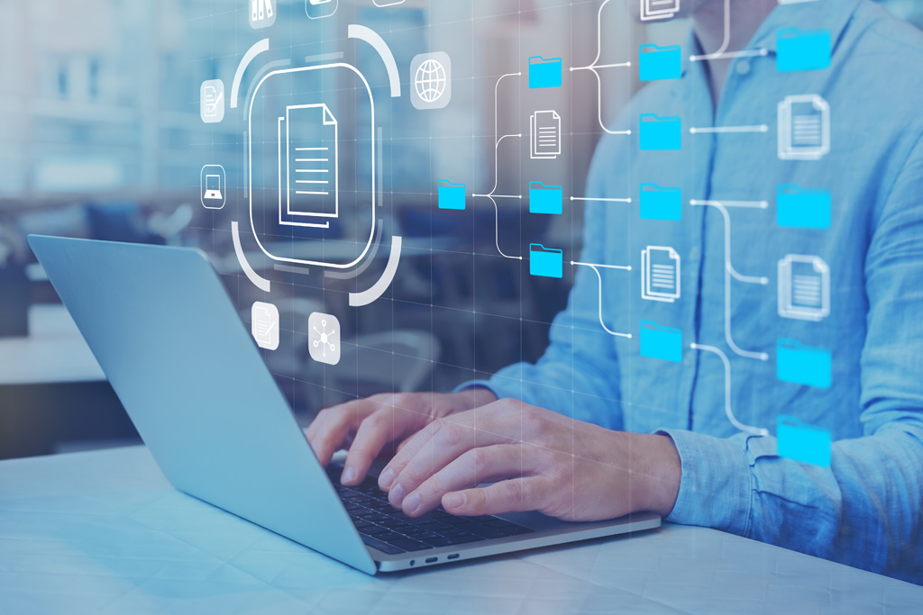 File Management Software with IT expert working on laptop computer