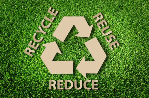 Paper cut of eco on green grass